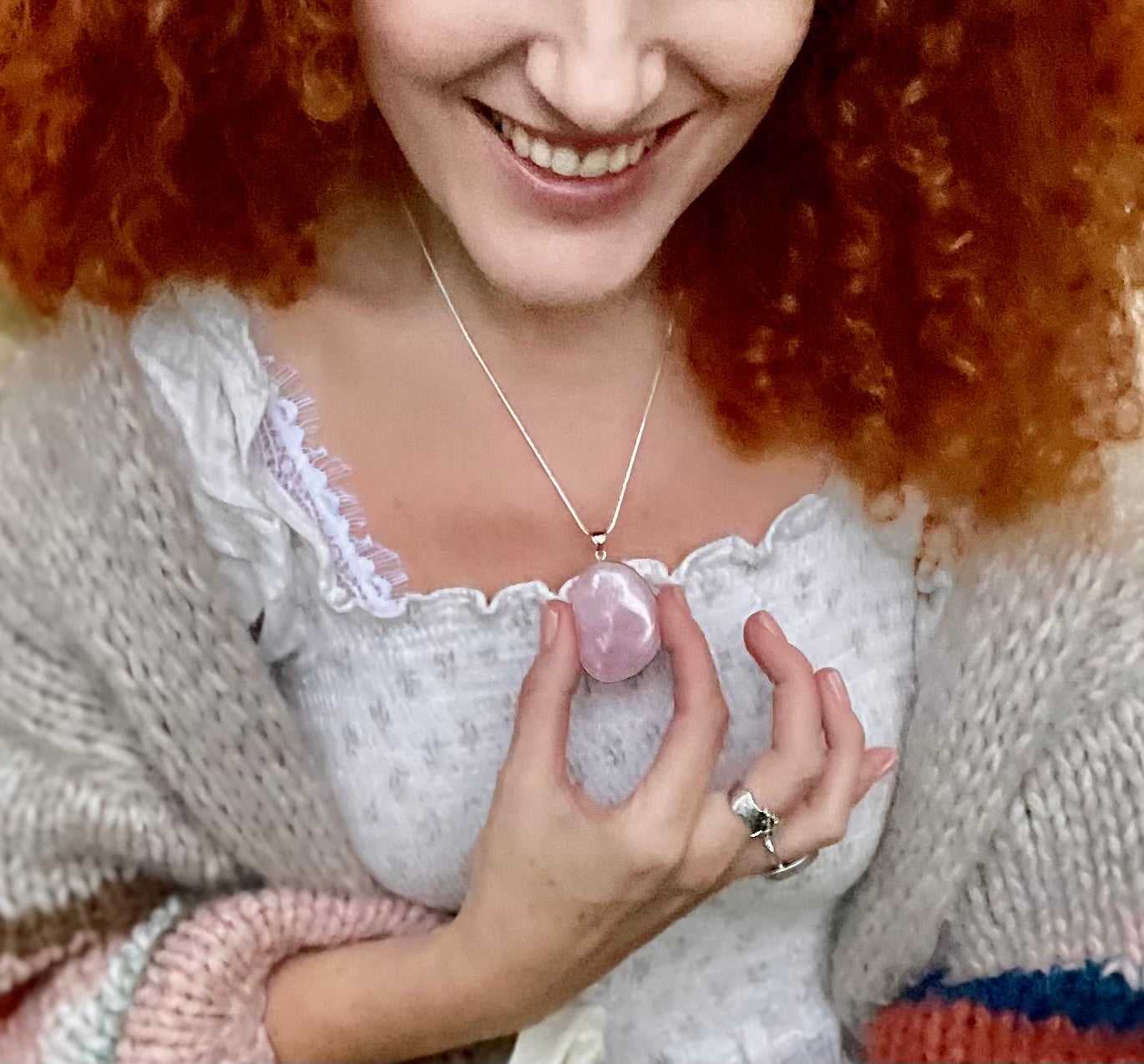 Rose quartz cabachon pendant on a chain modelled