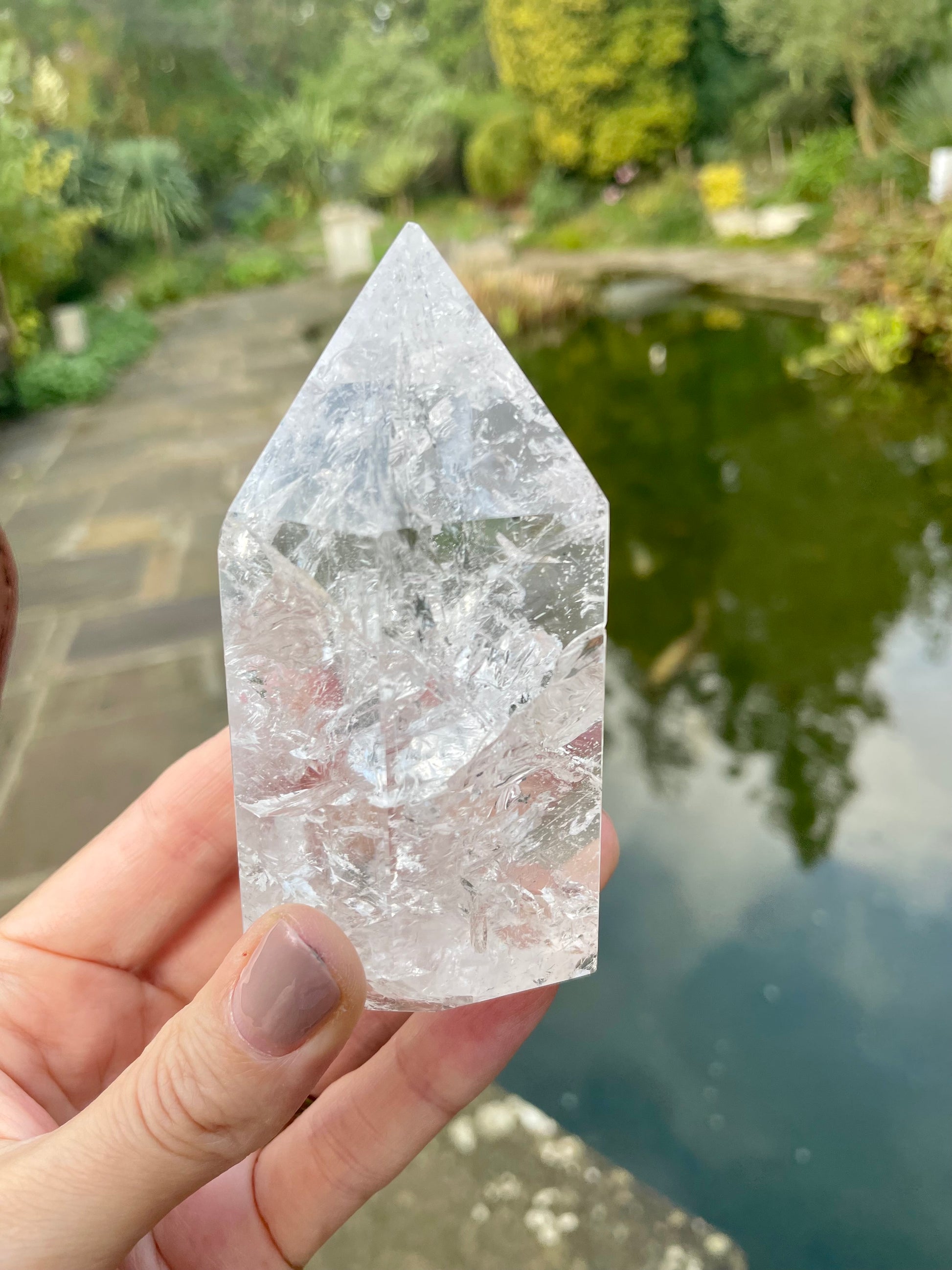 Fire and Ice clear quartz with beautiful inclusions photographed by water.