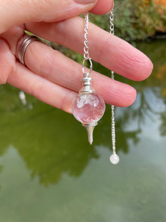 Clear quartz pendulum photographed by water.