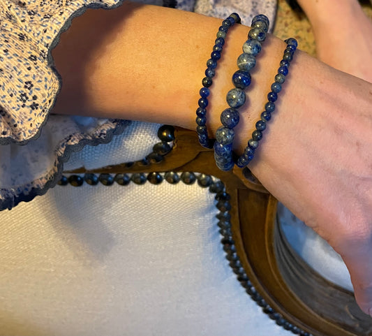 Set of three lapis lazuli crystal bracelets modelled on a wrist