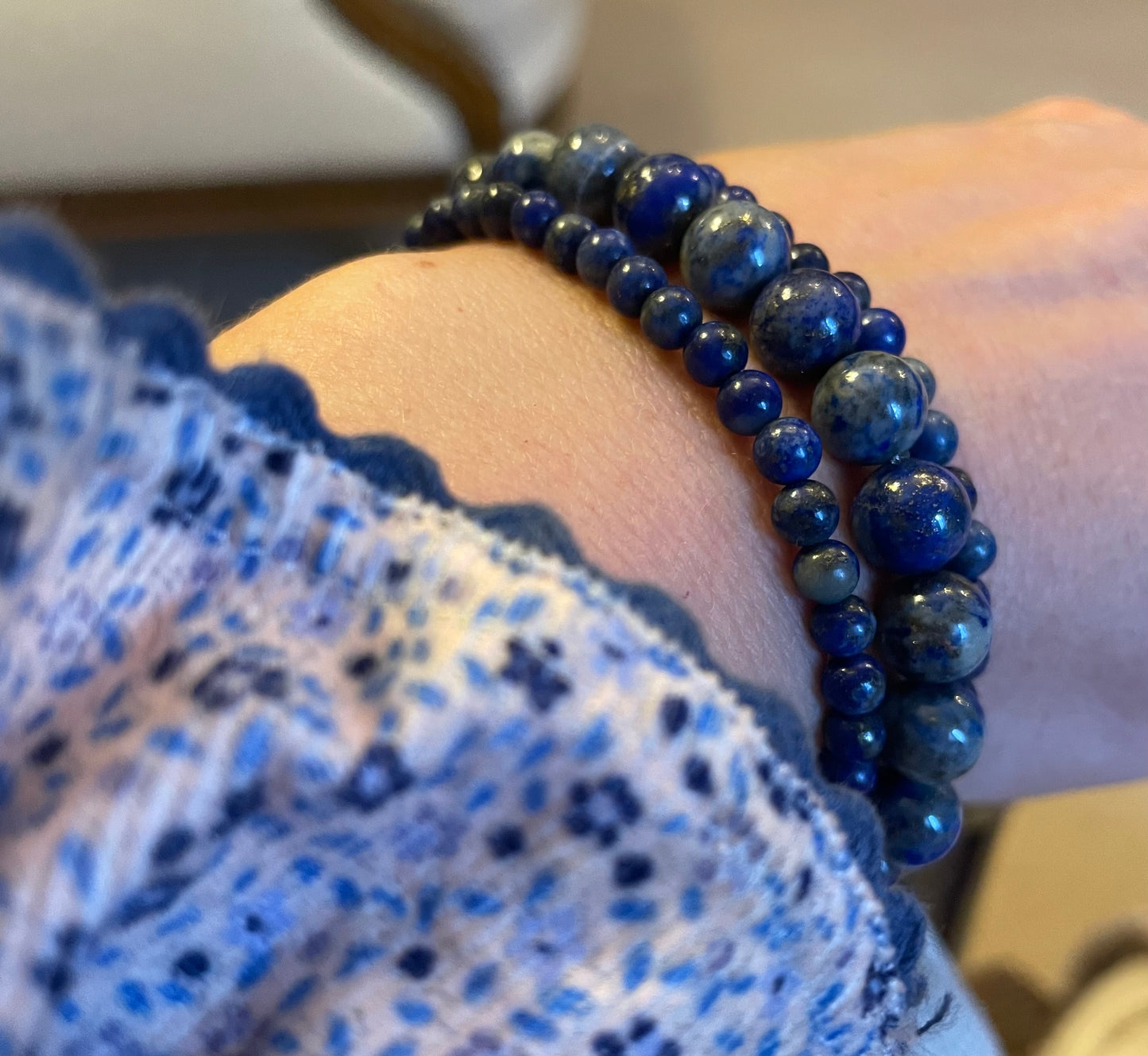 Set of three lapis lazuli crystal bracelets modelled on a wrist